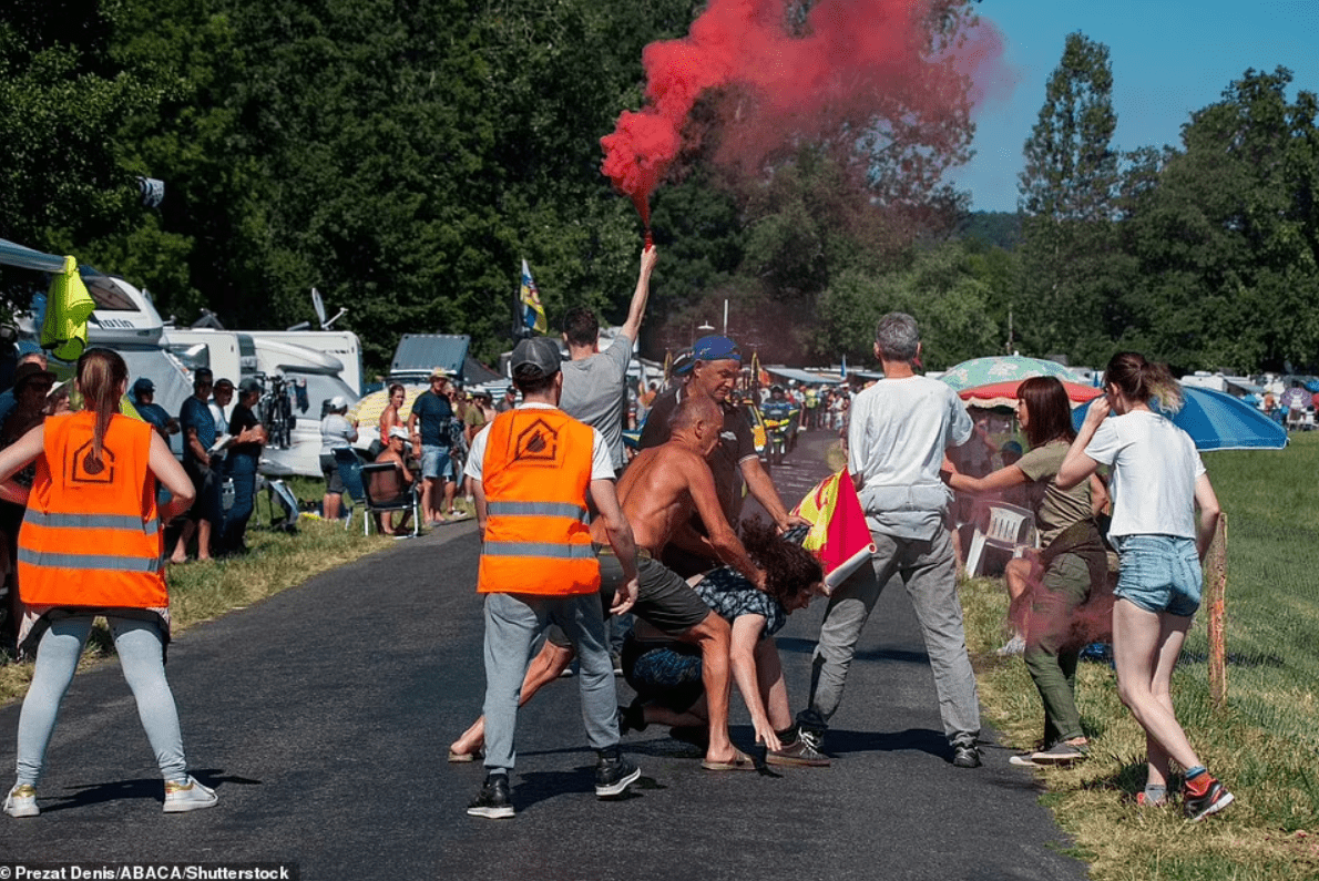 tour-de-france-fans-drag-eco-protesters-trying-to-block-race-off-the-road