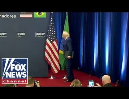 Biden almost takes out flag on way up to podium